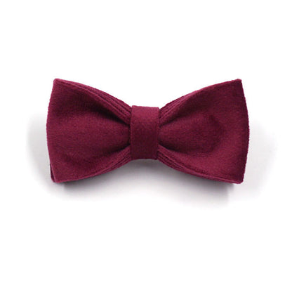 Soft burgundy velvet dog collar shown in close-up, featuring a comfortable fabric design.