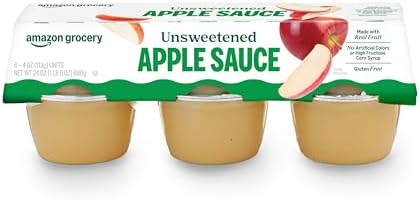 Six 4 oz Amazon Grocery unsweetened applesauce cups, with smooth, natural apple sauce inside bright packaging.