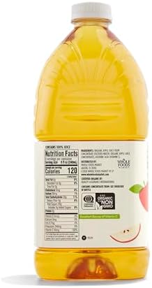 Bottle of 365 by Whole Foods Market Organic Apple Juice, 64 fl oz, with clear label showing fresh apples and natural juice inside.