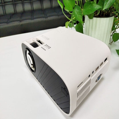 Portable projector, compact design with lens and control panel visible