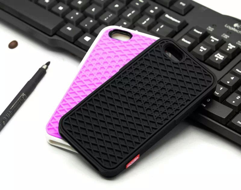 Waffle sole silicone phone case in black with textured tread pattern and raised edges