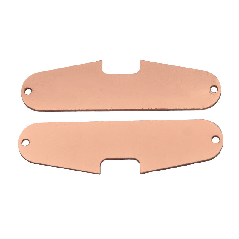Electric guitar single-coil pickup with copper base plate, close-up view