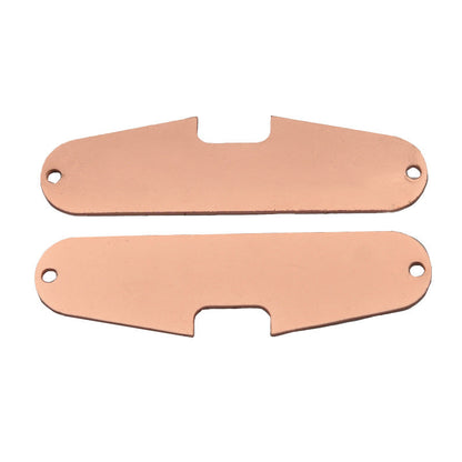 Electric guitar single-coil pickup with copper base plate, close-up view