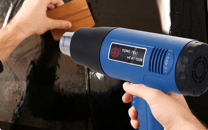 Industrial heat gun with durable handheld design and adjustable airflow nozzle