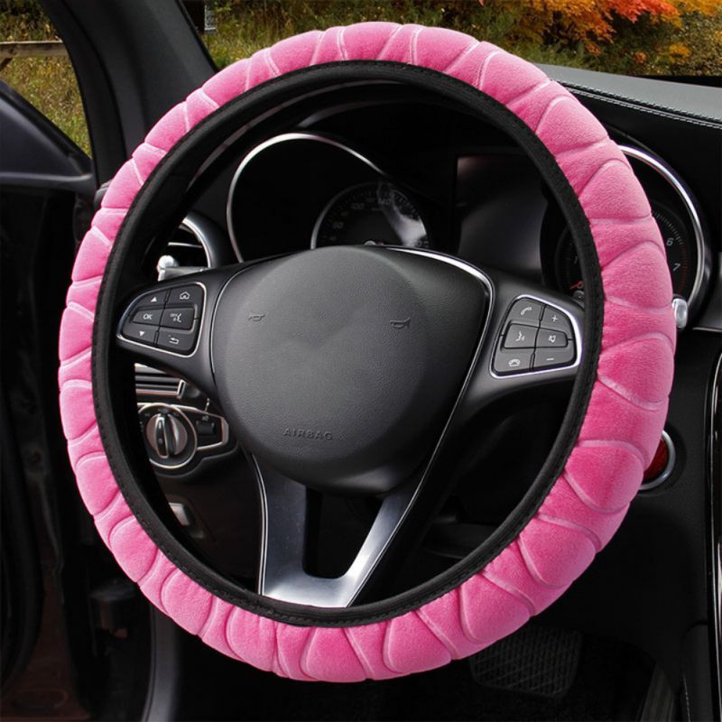 Plush car steering wheel cover in soft fabric, shown fitted around a vehicle steering wheel