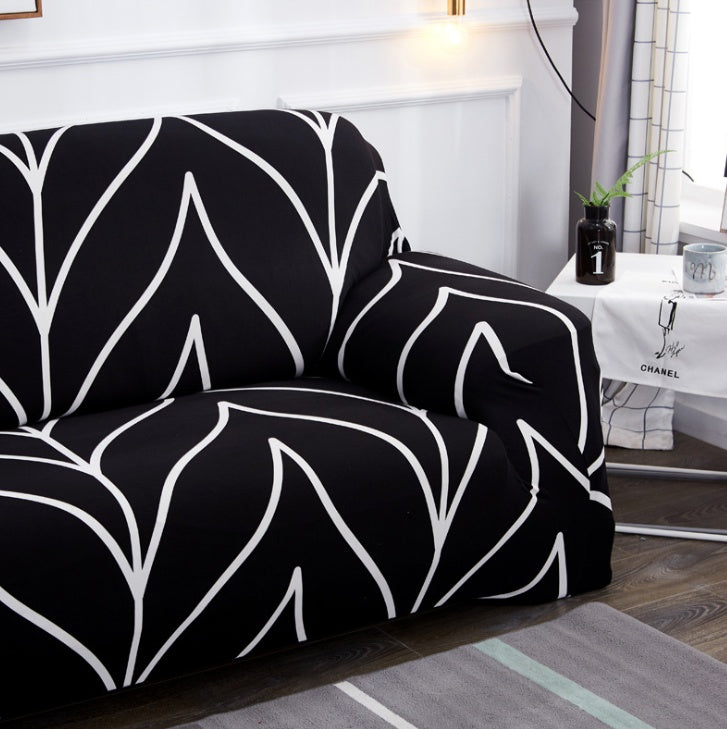 Elastic universal sofa cover in solid color, stretching over a standard sofa for a snug fit