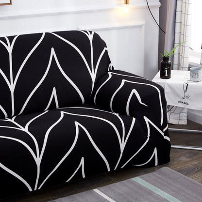 Elastic universal sofa cover in solid color, stretching over a standard sofa for a snug fit