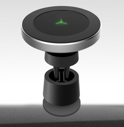 Car magnetic wireless charger mounted on a dashboard, featuring a compact black design and adjustable phone holder