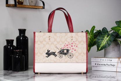 Coach Dempsey Medium Lunar New Year Rabbit Carryall Tote in leather with festive Lunar New Year design and spacious interior.