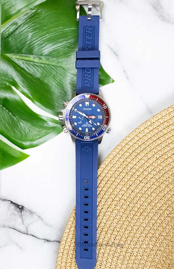 Citizen Promaster Diver Eco-Drive watch with interchangeable strap, featuring a black dial and stainless steel case.