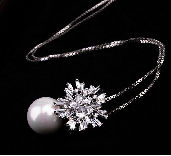 Pearl zircon necklace with lustrous pearls and sparkling zircon pendant close-up