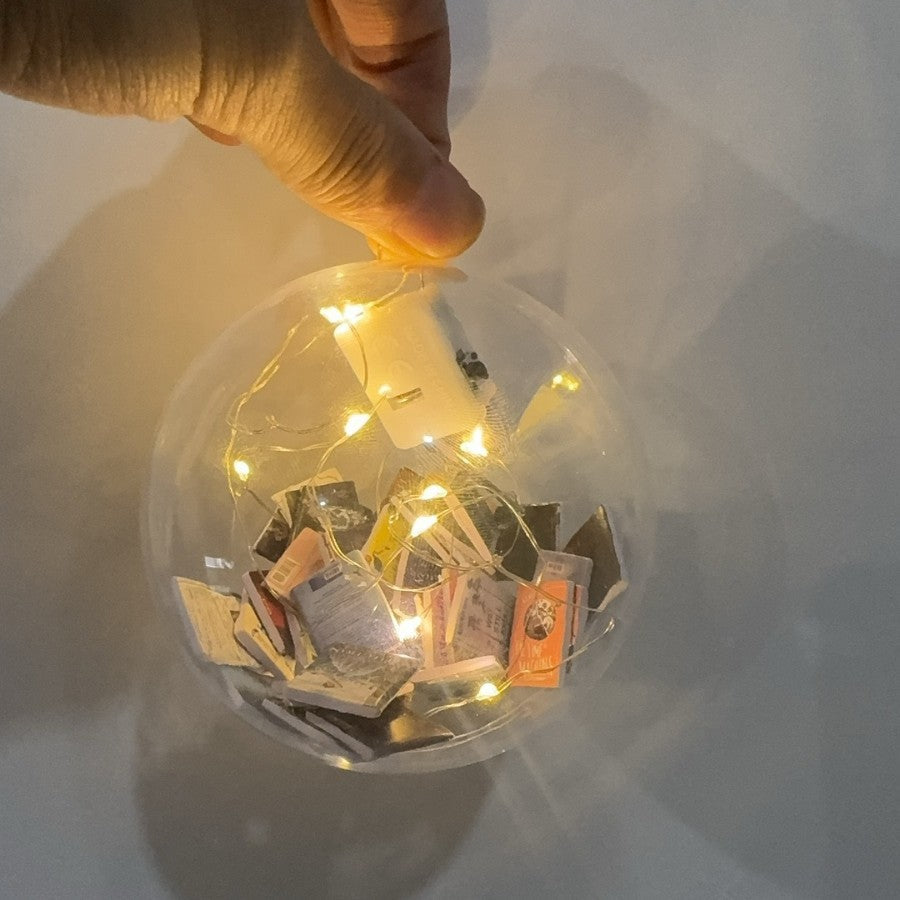 Christmas ball pendants decorated with colorful books, hanging Christmas decorationsalt text