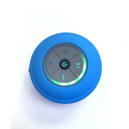 Mini waterproof Bluetooth speaker in compact black design, shown from the front