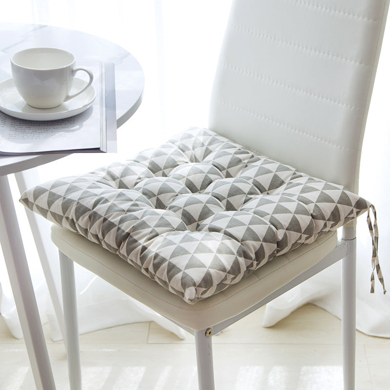Summer chair cushion in a light, breathable fabric for outdoor seating
