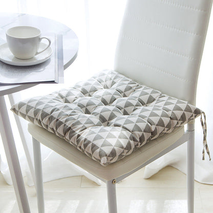 Summer chair cushion in a light, breathable fabric for outdoor seating