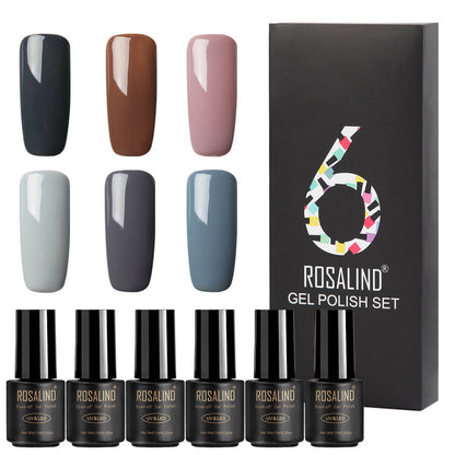 Six bottles of Fine nail polish in assorted colors displayed together