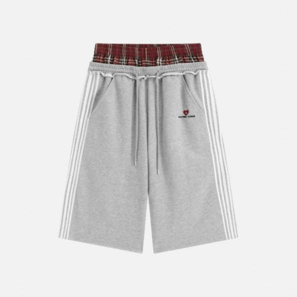 Retro striped embroidered athletic shorts with a sporty design and visible embroidered detailing