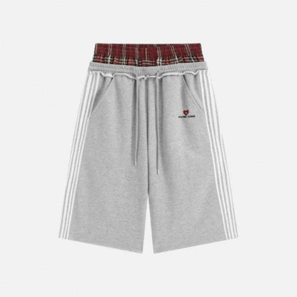 Retro striped embroidered athletic shorts with a sporty design and visible embroidered detailing