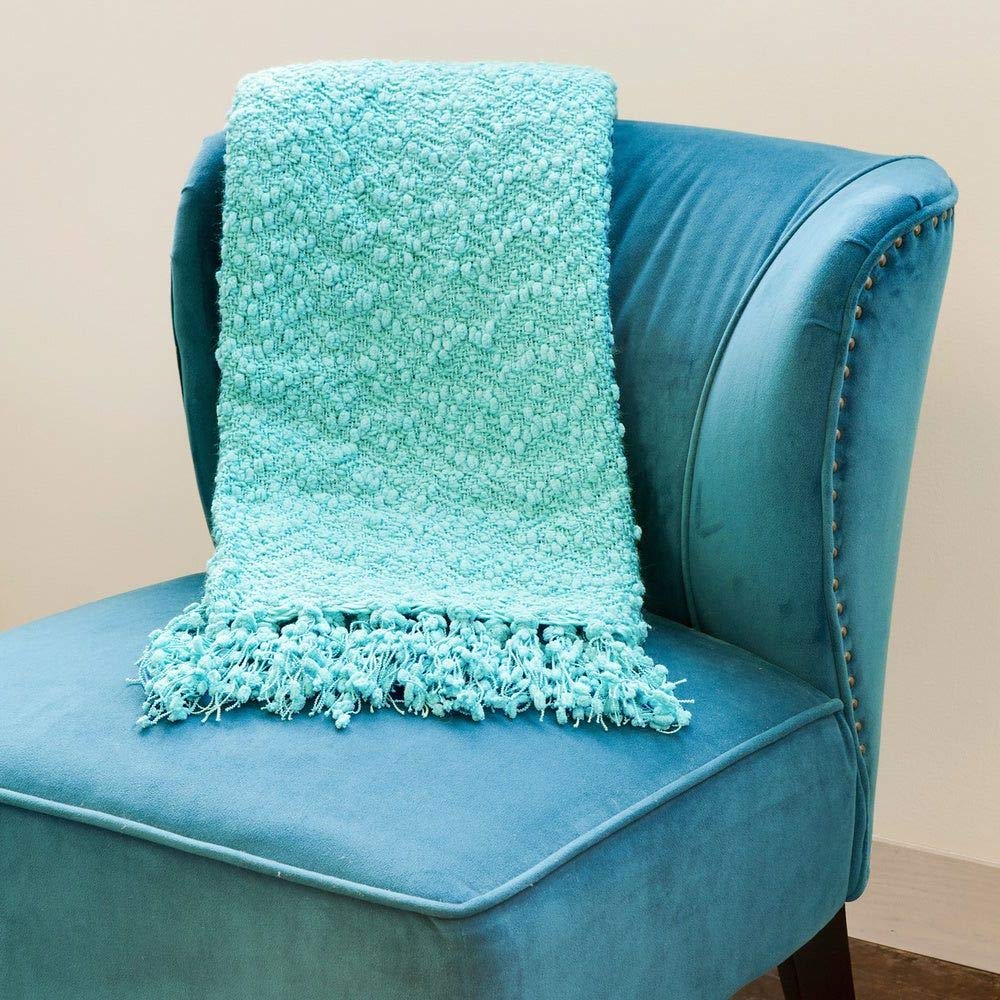 Pool blue microfiber throw blanket with popcorn texture, Victorian style, used on sofa or bed for cozy all-season comfort.