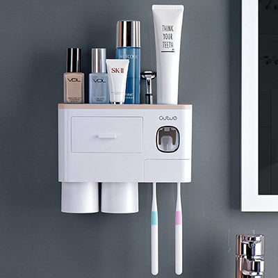 Non-marking hanging magnetic toothbrush holder with single drawer, toothpaste squeezer, and toiletry storage rack
