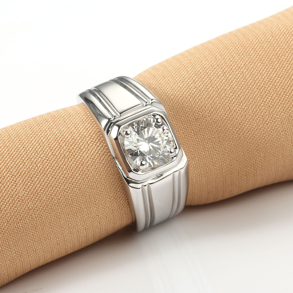 Sterling silver gold-plated moissanite ring with a sparkling stone in a polished setting