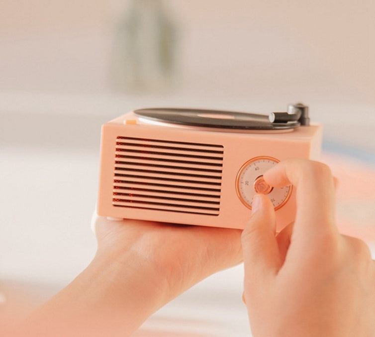 Retro vinyl Bluetooth speaker with wireless connectivity and compact design