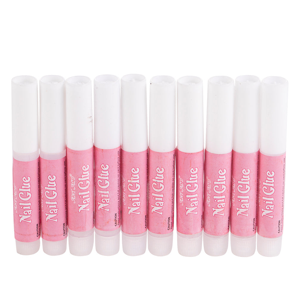 Nail art glue for personal use in a small clear bottle with precision applicator