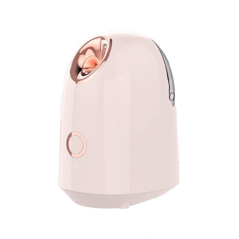 Beauty steamer with compact design for facial skincare treatments, viewed against a plain background