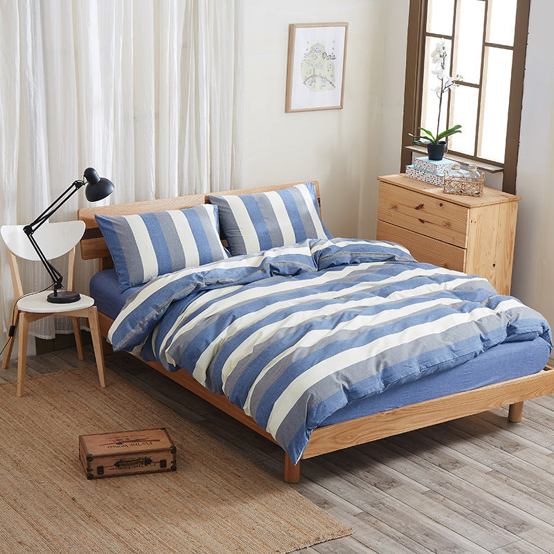 Pure cotton four-piece bed sheet set in soft, breathable fabric with matching pillowcases and duvet cover