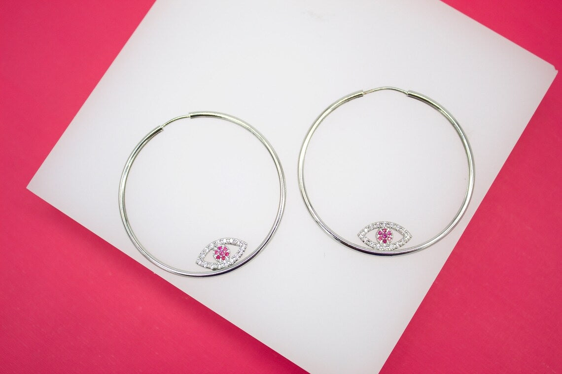 MIA Jewelry evil eye endless hoop earrings with micro CZ stones, silver-tone hoops featuring intricate eye design and sparkling accents.