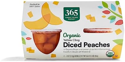 Canned 365 by Whole Foods Market organic diced peaches in a 16-ounce can, showing golden peach pieces in syrup.