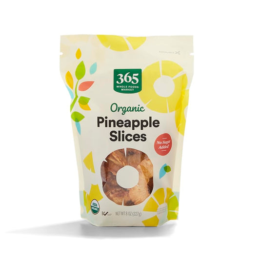 Organic dried pineapple pieces in a clear bag, 8 ounces, from 365 by Whole Foods Market, ready for snacking or baking.