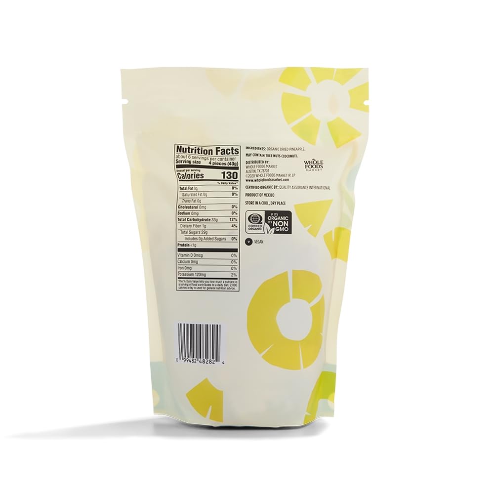 Dried organic pineapple slices in an 8-ounce package from 365 by Whole Foods Market, showing golden dried fruit pieces.