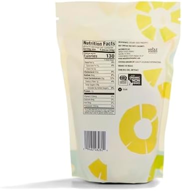 Organic dried pineapple slices from 365 by Whole Foods Market in an 8-ounce package, showing golden, chewy dried fruit pieces.