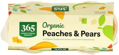 Four 365 by Whole Foods Market organic peaches and pears snack cups with fresh fruit slices in colorful cups.