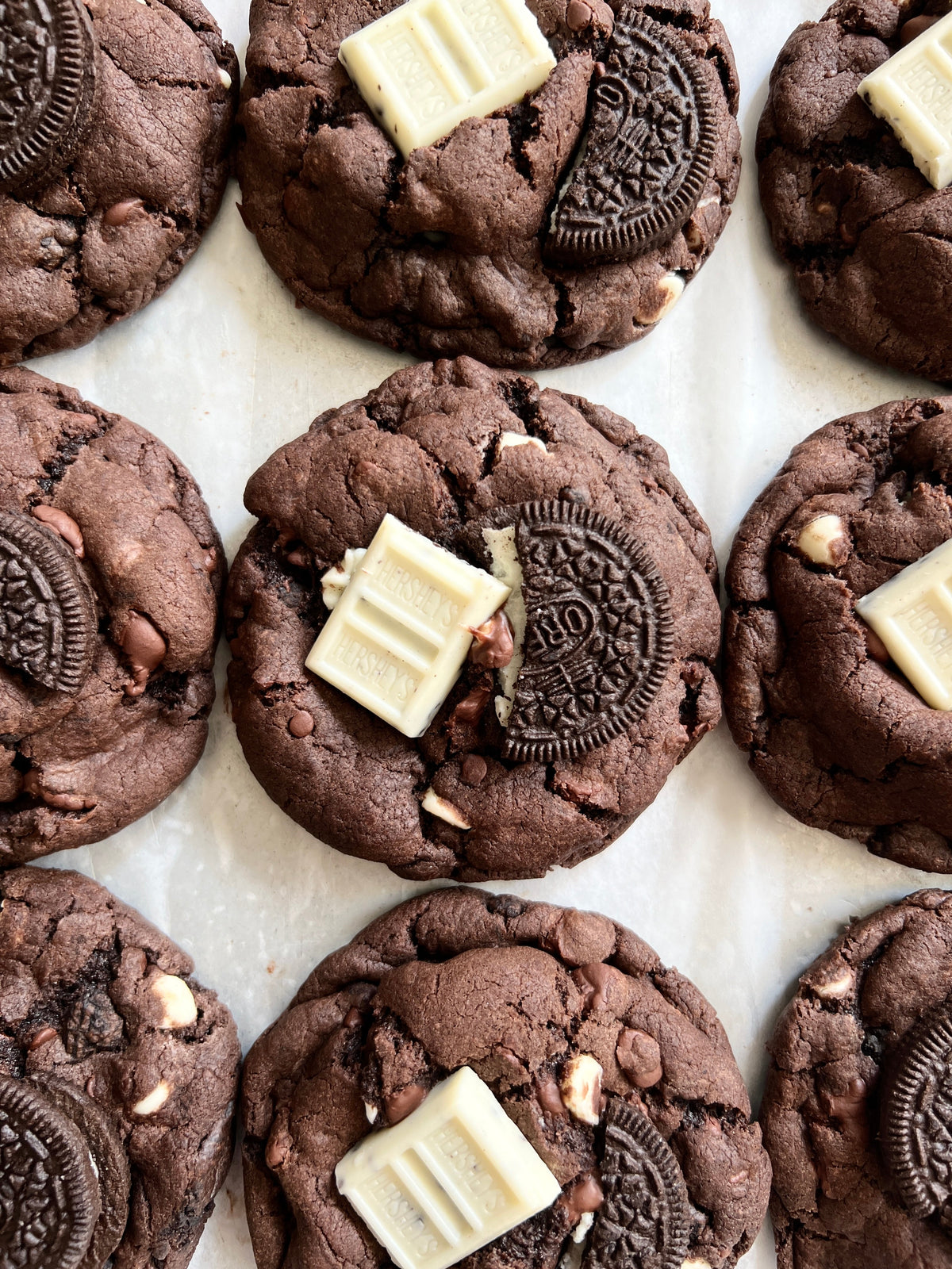 Chocolate Cookies & Cream cookies from Let's Get Baked Artisan Desserts, showing crispy cookies with chocolate and cream filling.