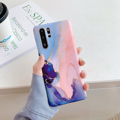 Marble phone case with white and gray stone pattern encasing a smartphone
