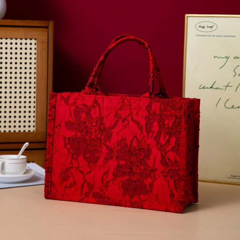 Relief-printed souvenir canvas gift bag with textured design and sturdy fabric handles
