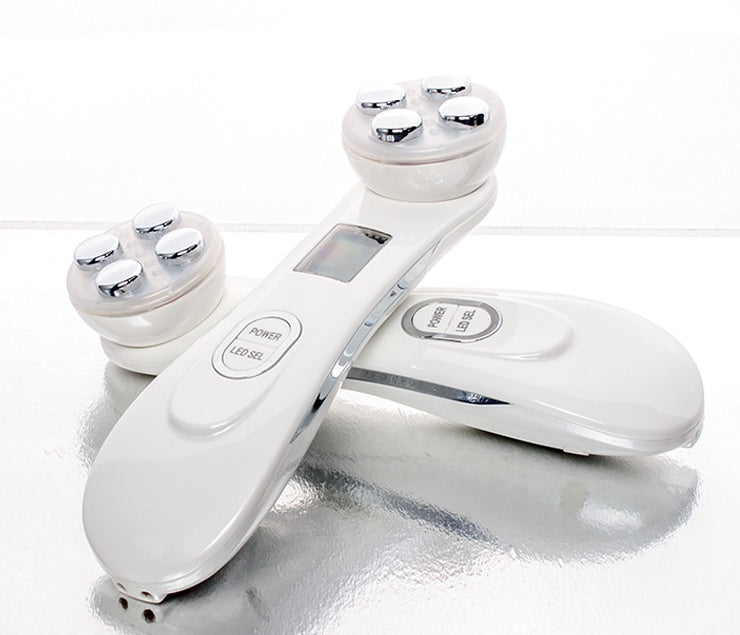 Multifunctional skin rejuvenation care instrument in white with digital display and handheld treatment probe