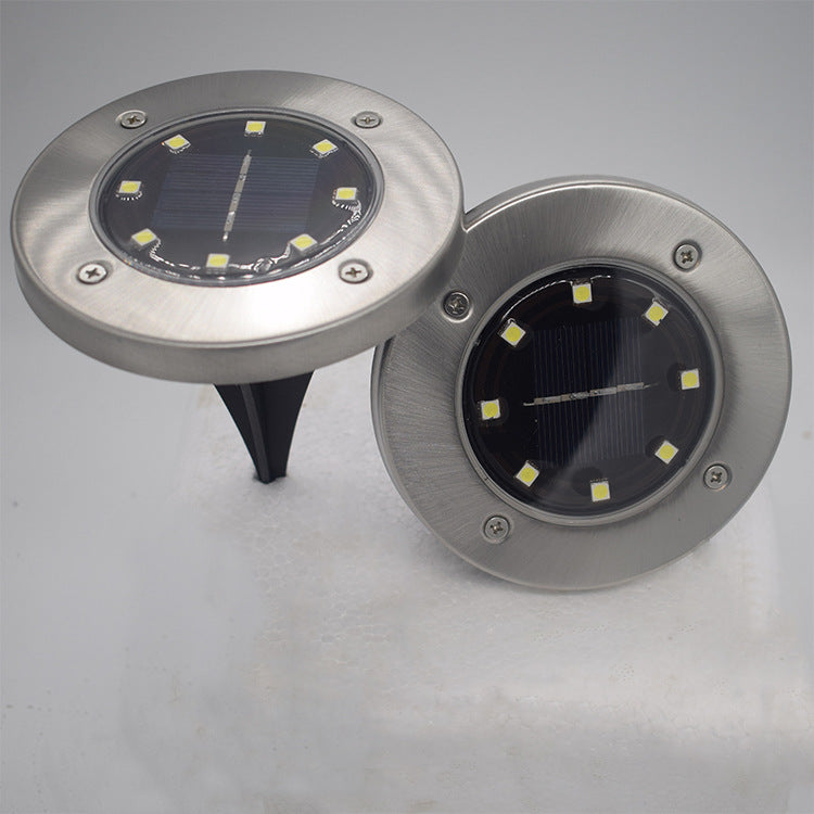 8LED waterproof solar powered garden lights with compact outdoor design for illuminating pathways and flower beds