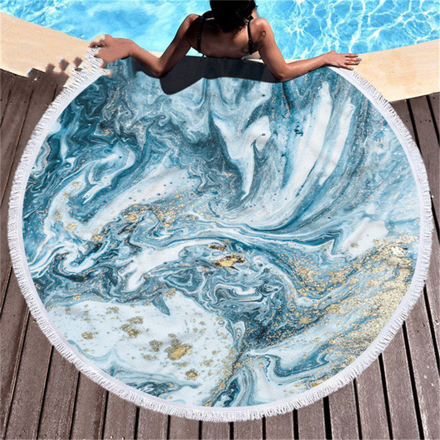 Marbling beach towel with swirling marbled pattern in soft blue and white tones