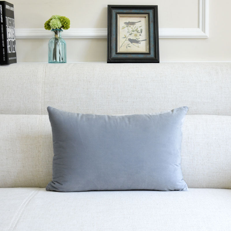 Velvet throw pillow for sofa in soft, textured fabric, displayed in a simple product view