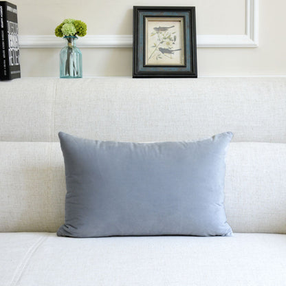 Velvet throw pillow for sofa in soft, textured fabric, displayed in a simple product view