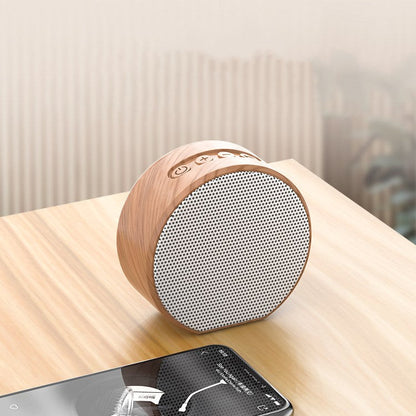 Wood grain Bluetooth speaker with natural finish and compact design