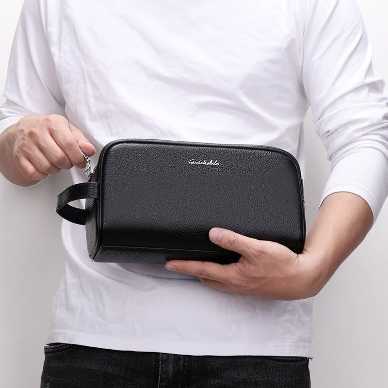 Men's leather clutch wallet handbag in a compact rectangular design with a wrist strap