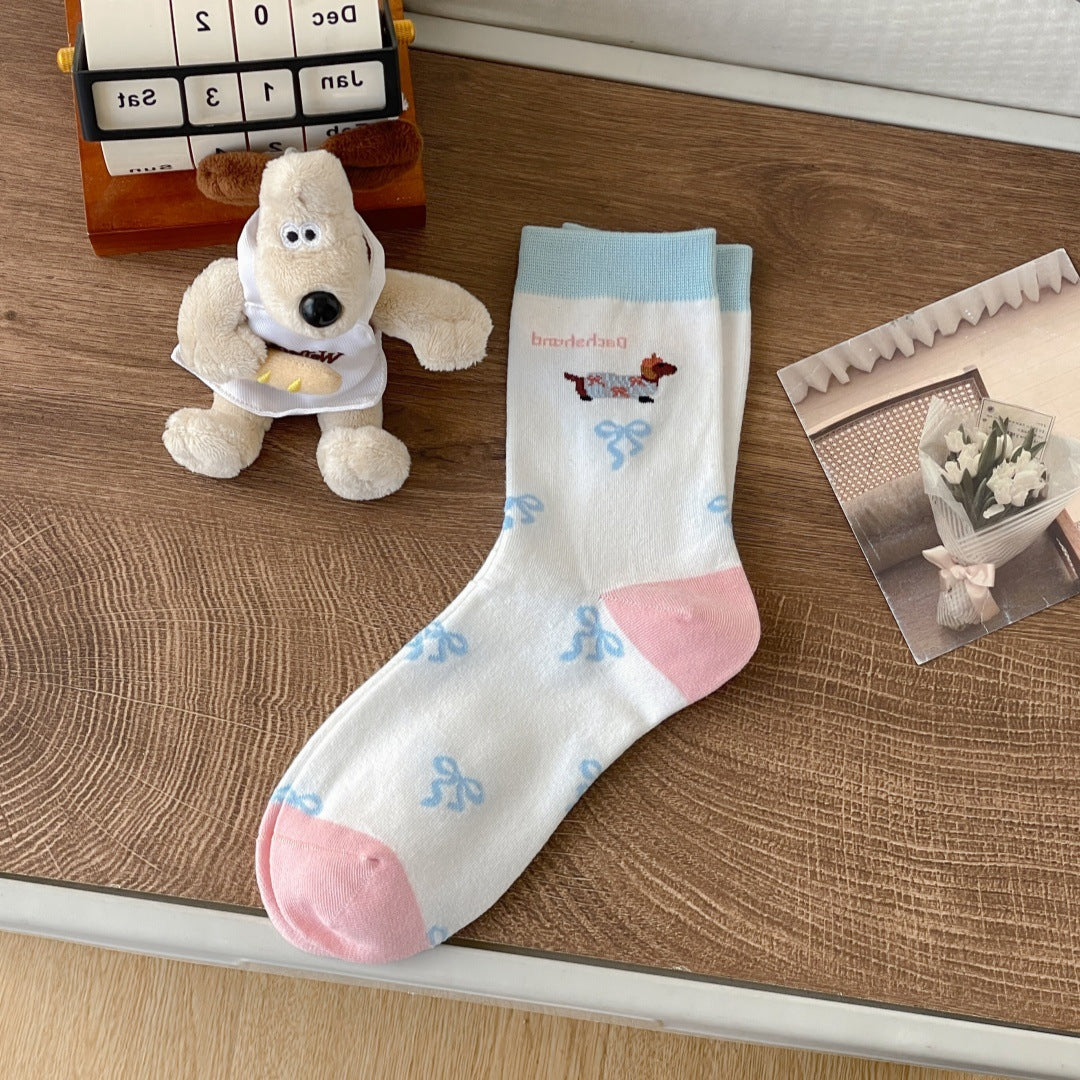 Cartoon dachshund socks for women featuring playful dog illustrations in a colorful pattern