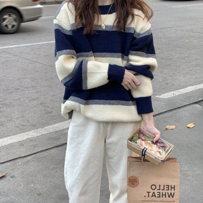 Retro thick knit outerwear in a relaxed fit, shown in a neutral color‑wrapped garment.