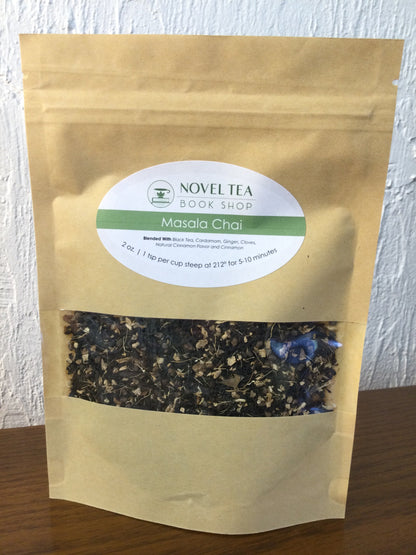 Loose leaf Masala Chai black tea from Novel Tea Book Shop, with aromatic spices and dark tea leaves in a close-up image.