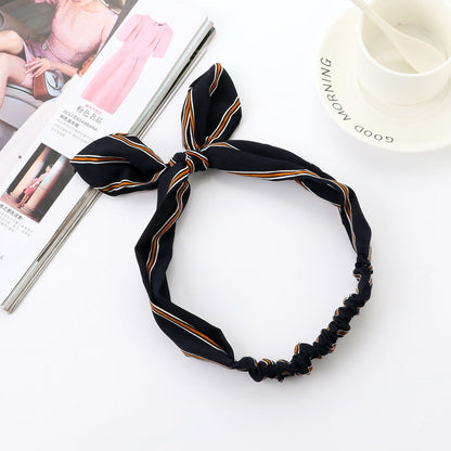 Big bow tie bunny ears headband with soft fabric ears and oversized bow detail