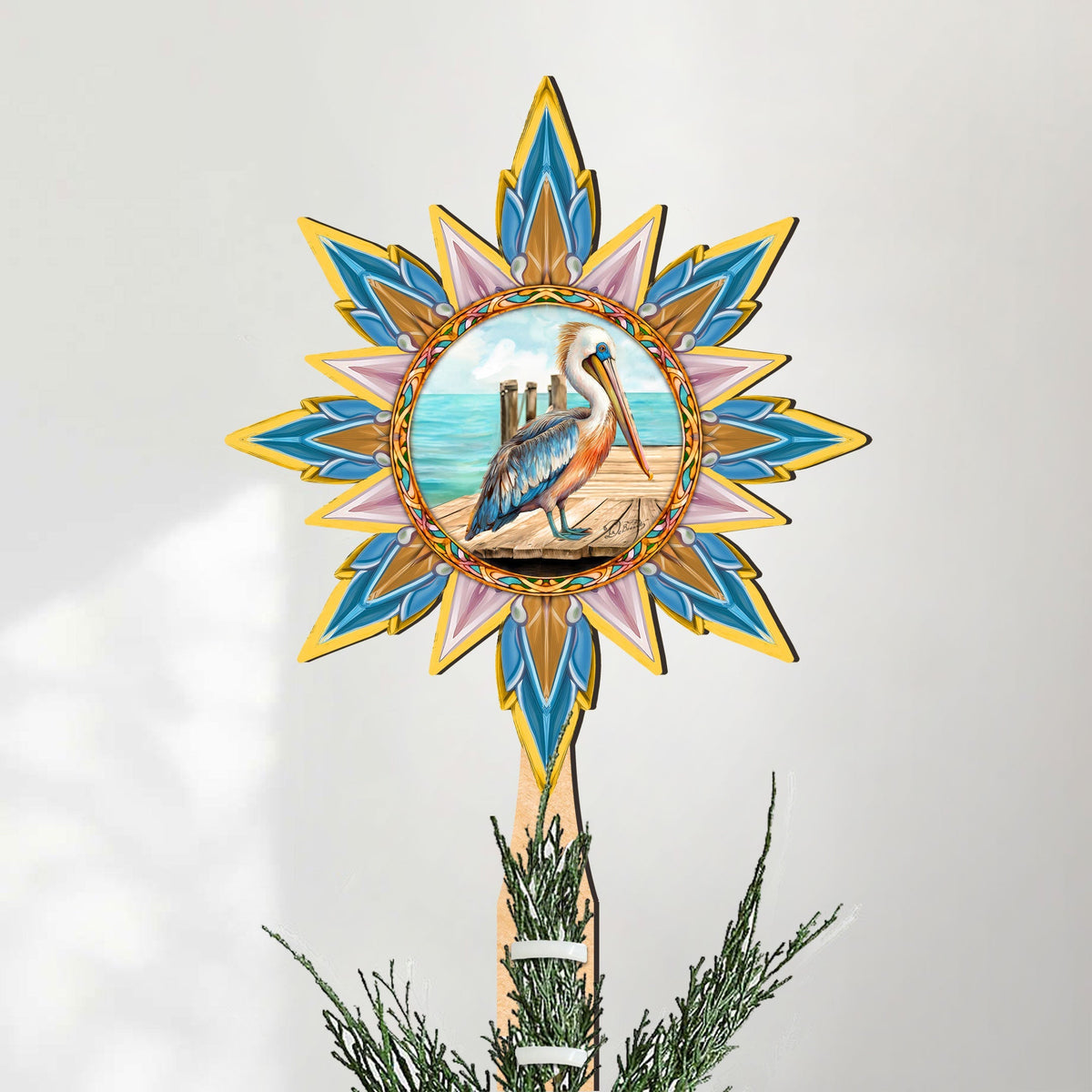 Wooden Coastal Pelican Star Tree Topper by G. DeBrekht, featuring a detailed wildlife-themed star design for holiday decor.